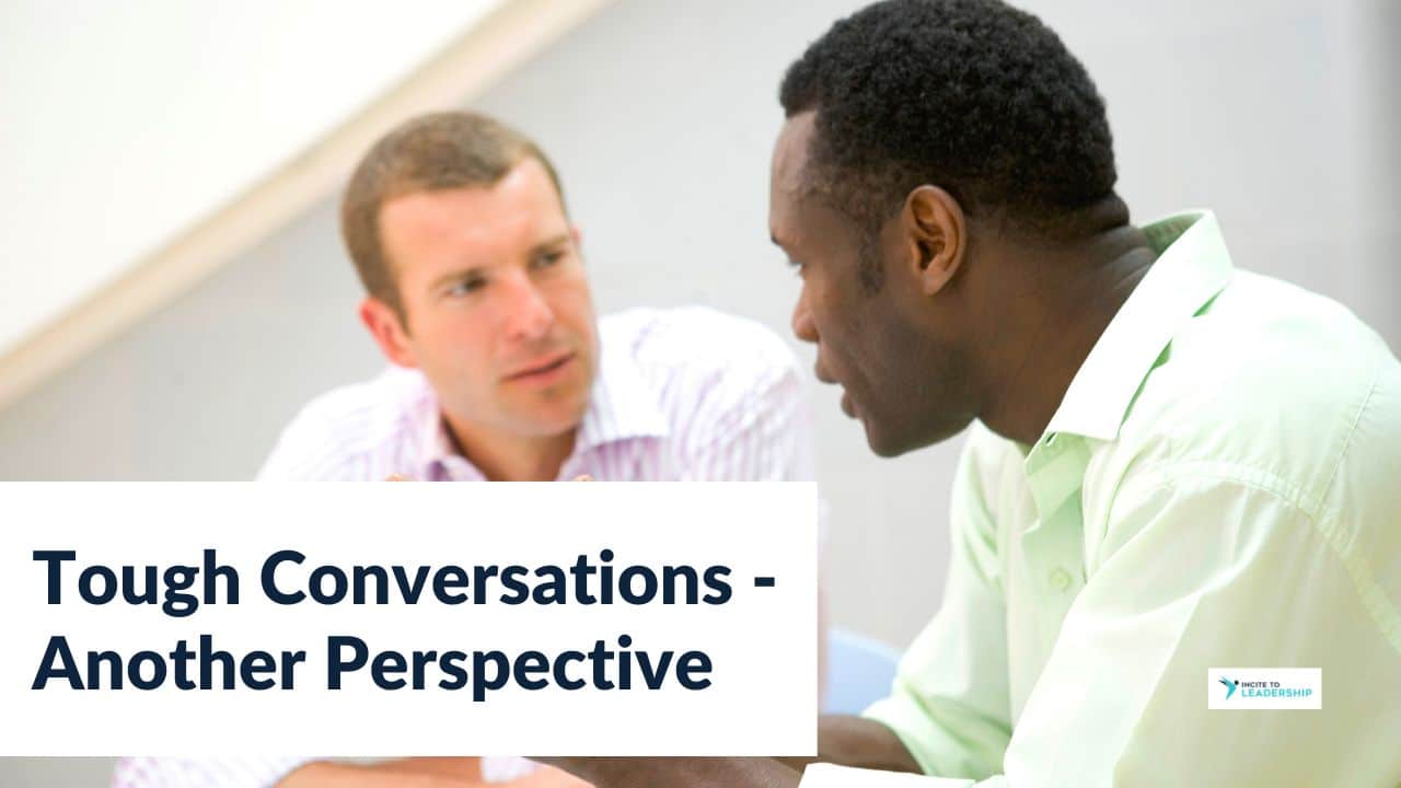 For this article by Jo Ilfeld, Executive Leadership Coach on tough conversations, the image shows two diverse men talking with serious faces.