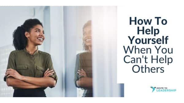 For this article by Jo Ilfeld, Executive Leadership Coach on help yourself first the image shows a young Black woman smiling and looking in the mirror.