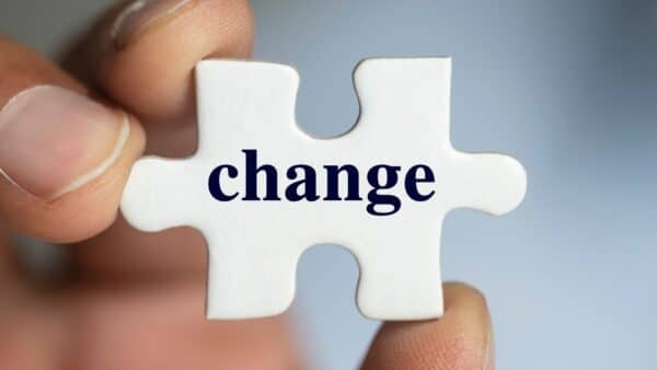 For this article by Jo Ilfeld, Executive Leadership Coach on change the image shows a jigsaw puzzle piece with the word change written on it.