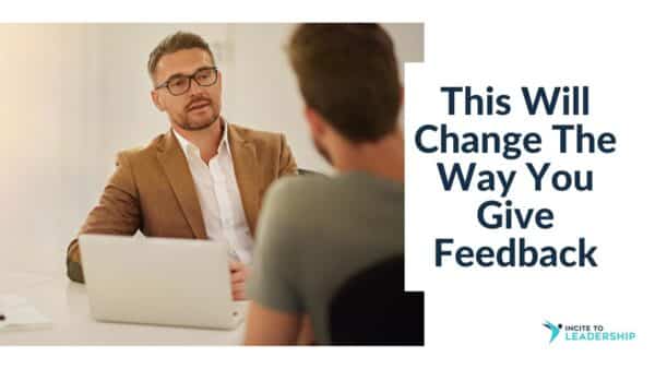 For this article by Jo Ilfeld, Executive Leadership Coach on feedback the image shows a man talking to another male across a desk with a laptop in between them.