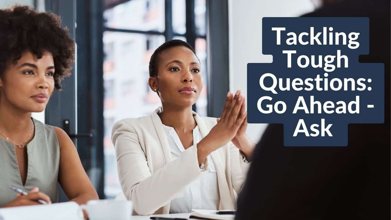 For this article by Jo Ilfeld, Executive Leadership Coach on asking tough questions the image shows two women sitting across the table from someone else engaged in a deep discussion.