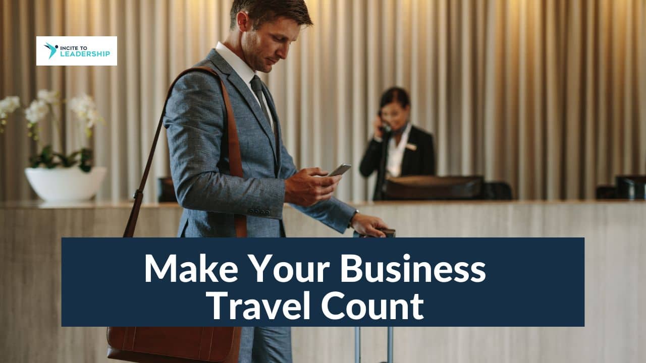 For this article by Jo Ilfeld, Executive Leadership Coach on business travel the image shows a man in a suit checking into a hotel.